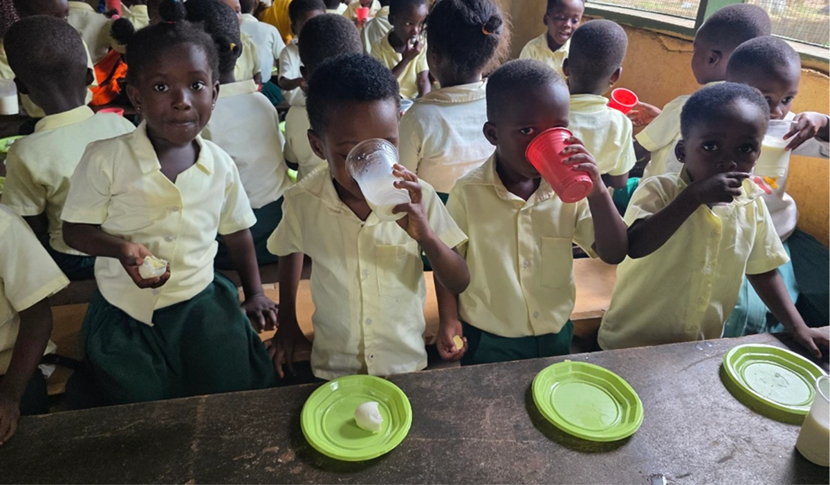 Students drinking milk at school